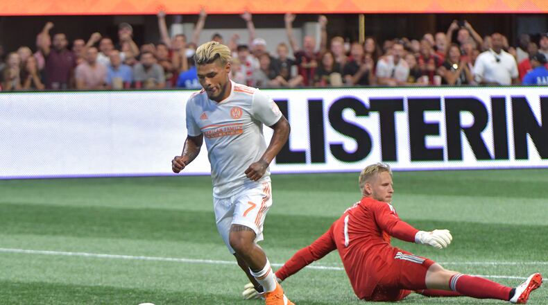 July 21, 2018  - Atlanta United forward Josef Martinez (7) gets past D.C. United goalkeeper David Ousted (1) to shoot for his 6th career MLS hat trick during the second half in a MLS soccer game at Mercedes-Benz Stadium on Saturday, July 21, 2018. Three more goals from Josef Martinez set a new MLS record lifted Atlanta United to a 3-1 victory over D.C. United on Saturday at Mercedes-Benz Stadium. HYOSUB SHIN / HSHIN@AJC.COM