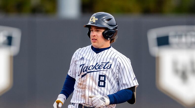 Georgia Tech outfielder Drew Burress (8) looks to the outfield to determine if he should continue to third base during a game Saturday, Feb. 17, 2024, in Atlanta. (AP Photo/Jason Allen)