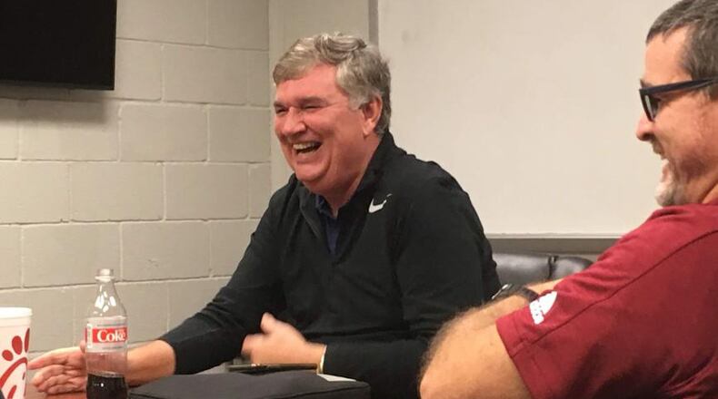 Former Georgia Tech coach Paul Johnson shares a laugh with Lassiter High assistant coach Michael Helmly in a meeting at the school Dec. 9, 2019. The coaching staff sought Johnson's knowledge as it considers running an offense similar to Johnson's. (AJC photo by Ken Sugiura)