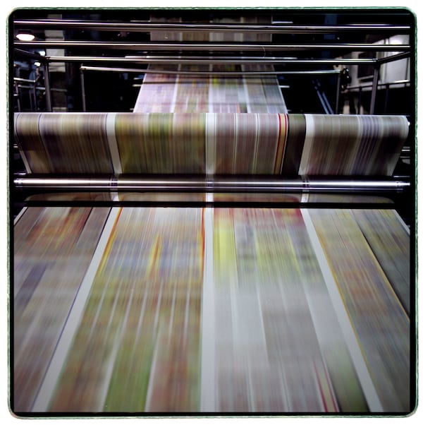 The Atlanta Journal-Constitution will no longer produce a printed paper in the new year. (Joey Ivansco/AJC)