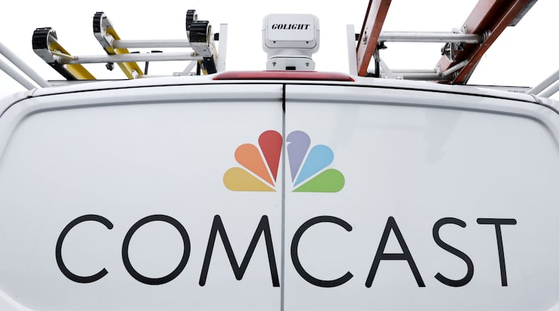 FILE- A Comcast truck is shown on Jan. 24, 2019, in Pittsburgh. (AP Photo/Gene J. Puskar, File)