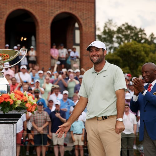 Scottie Scheffler of the United States celebrates with the FedExCup Trophy after winning the FedExCup and TOUR Championship at East Lake Golf Club on Sunday, Sept. 1, 2024, in Atlanta. (Courtesy of Mike Mulholland/Getty Images)