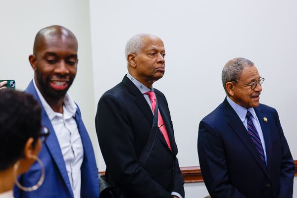 U.S. Rep. Hank Johnson, D-Lithonia (center) waits in line at the state Capitol to file paperwork to run for re-election on March 2, 2026. (Arvin Temkar/AJC)