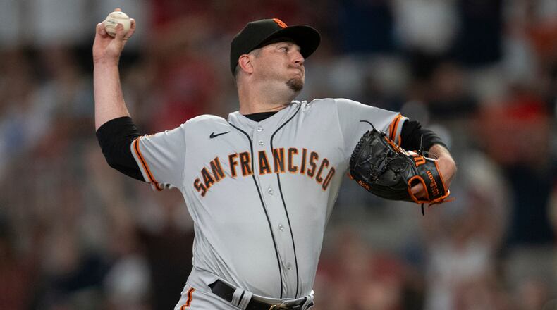 San Francisco Giants relief pitcher Luke Jackson throws to an Atlanta Braves batter during seventh inning of a baseball game Friday, Aug. 18, 2023, in Atlanta. (AP Photo/Hakim Wright Sr.)