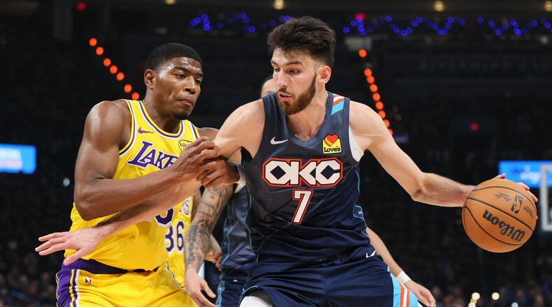 Oklahoma City Thunder center Chet Holmgren (7) works to the basket against Los Angeles Lakers forward Rui Hachimura (28) in the second half of Game 2 in a second-round NBA basketball playoffs series Thursday, May 7, 2026, in Oklahoma City. (AP Photo/Nate Billings)