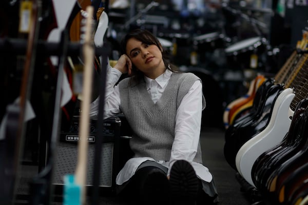 Singer Csndra visits Music Go Round, a music shop she frequents for inspiration, on Wednesday, Jan. 21, 2026, in Duluth. Her breakout single, “Cuida,” established her as a rising voice in the Latin indie pop scene. (Miguel Martinez/AJC)