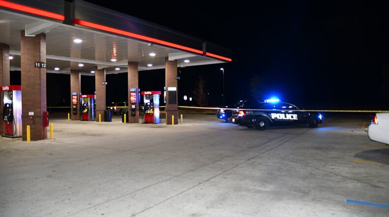 A man died in a shootout Saturday night outside a QuikTrip at the corner of Flat Shoals Parkway and Clifton Springs Road.