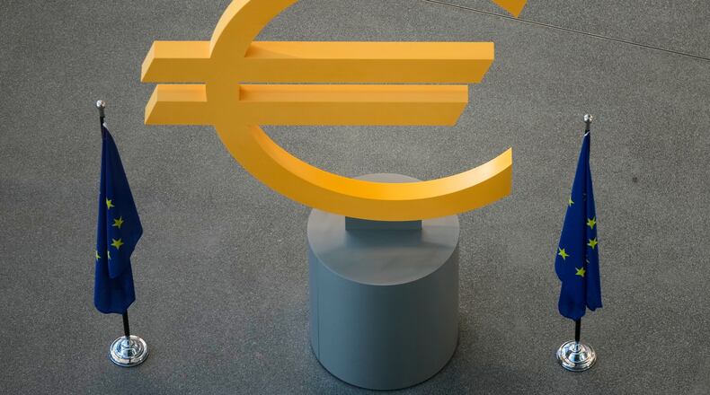 FILE -The Euro currency symbol is seen prior to a press conference after an ECB's governing council meeting in Frankfurt, Germany, Dec. 18, 2025. (AP Photo/Michael Probst, File)