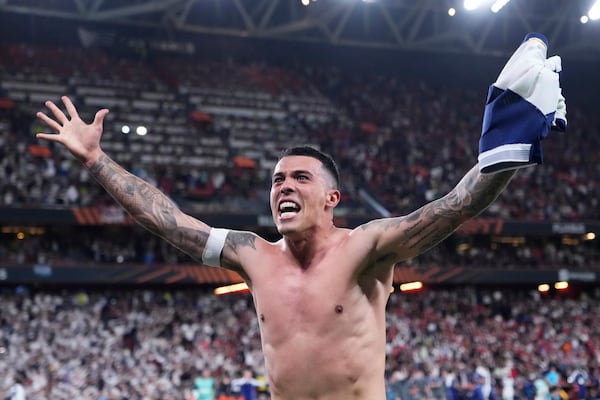 Tottenham's Pedro Porro celebrates after winning the Europa League final soccer match between against Manchester United at the San Mames Stadium in Bilbao, Spain, Wednesday, May 21, 2025. (AP Photo/Jose Breton)