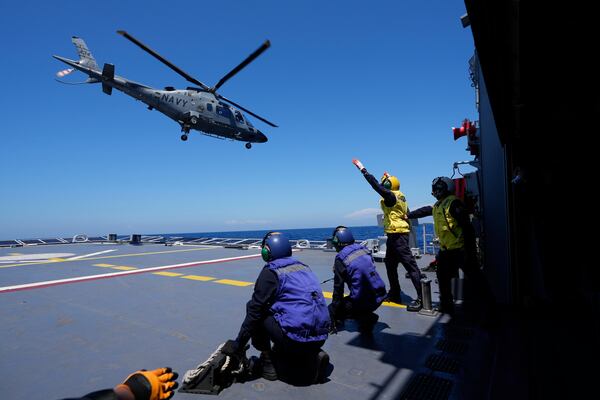 A Philippine Navy AW109 helicopter takes off from Philippine Navy Ship Jose Rizal during the Philippines United States Japan Multilateral Maritime Cooperative Activity off a disputed South China Sea shoal on Friday, March 28, 2025. (AP Photo/Aaron Favila)