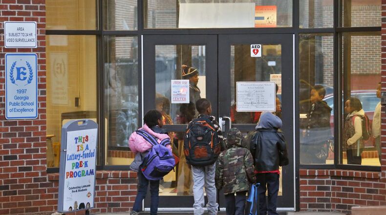Whitefoord Elementary School students arrive to the start of school. The Altanta Board of Education voted March 6 to close Whitefoord and Adamsville elementary schools next year.