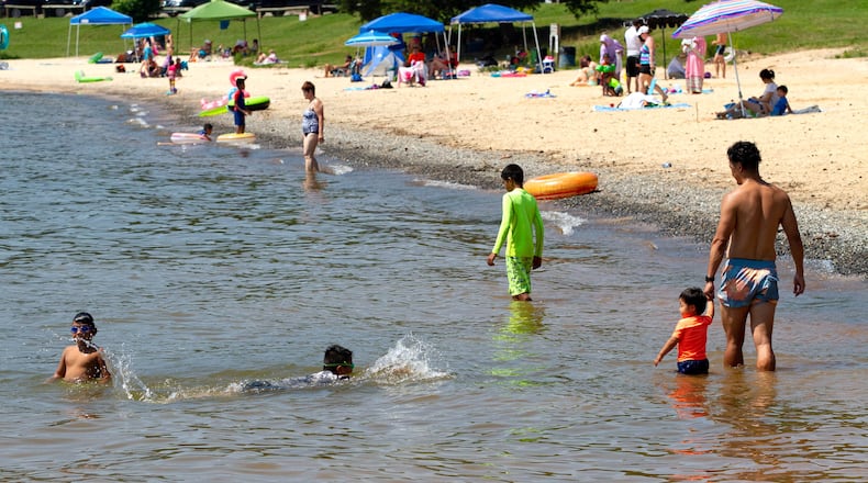 People enjoy the water on a hot Sunday afternoon at Mary Alice Beach Park in Lake Lanier on Sunday, July 5, 2020. STEVE SCHAEFER FOR THE ATLANTA JOURNAL-CONSTITUTION