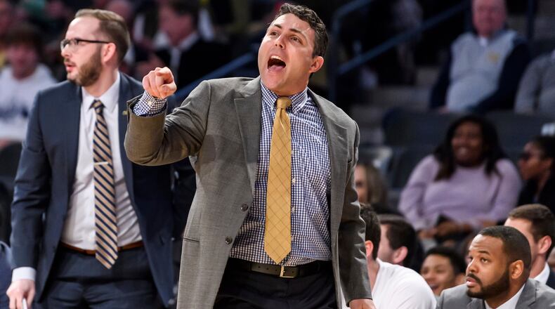 Georgia Tech head coach Josh Pastner speaks to his team in the first half of an NCAA college basketball game against Arkansas Monday, Nov. 25, 2019, in Atlanta. Arkansas won 62-61. (AP Photo/Danny Karnik)