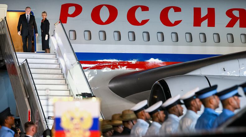 Russian President Vladimir Putin, left, leaves the plane upon his arrival for the BRICS Summit in New Delhi, India, on Friday, Sept. 11, 2026. (Vladimir Smirnov, Sputnik, Kremlin Pool Photo via AP)