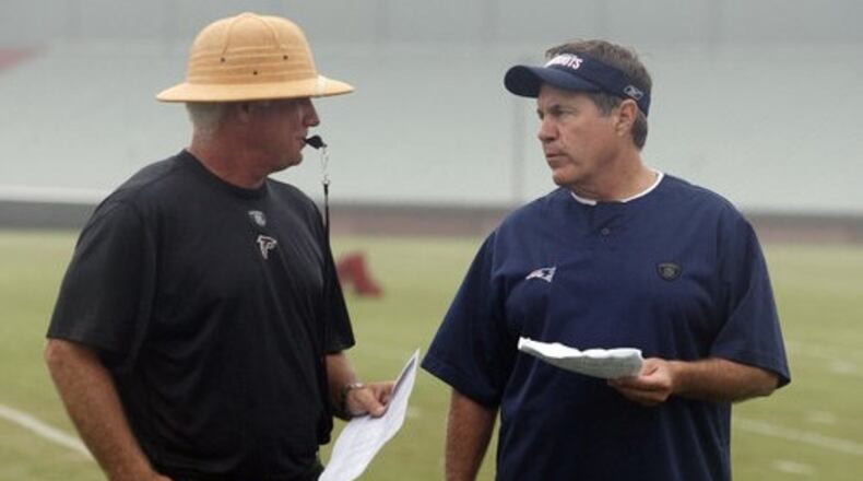 Bill Belichick (right) and former Falcons coach Mike Smith during a combined Patriots-Falcons practice in Flowery Branch before the 2010 NFL season. (Photo by Curtis Compton/AJC file)
