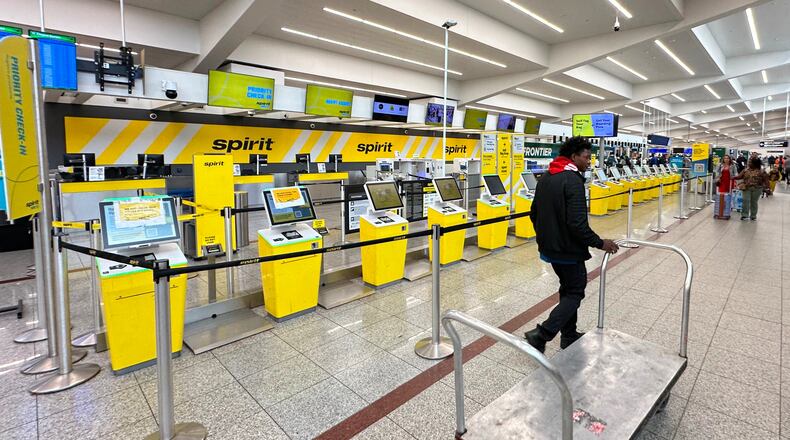 Spirit Airlines’ counter is passed by an airport employee after the airline’s shutdown on Saturday, May 2, 2026 at Hartsfield-Jackson Atlanta International Airport in Atlanta. (AP Photo/Jeff Amy)