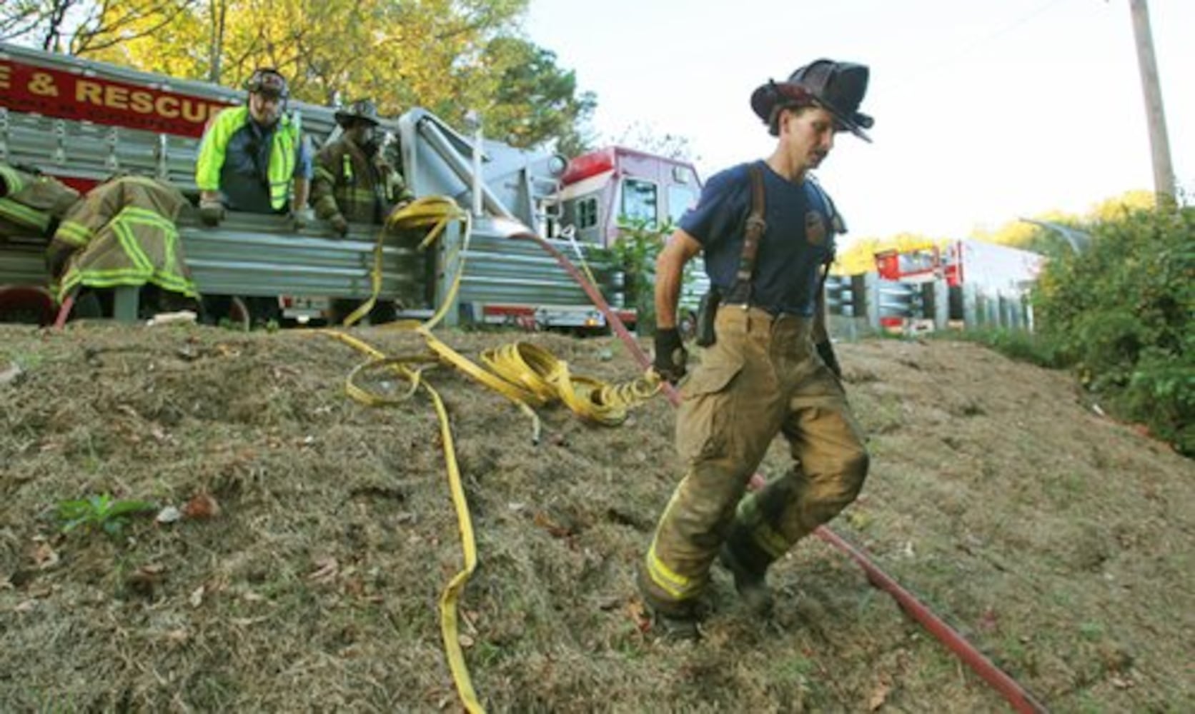 DeKalb firefighters fight brush fire near I-285