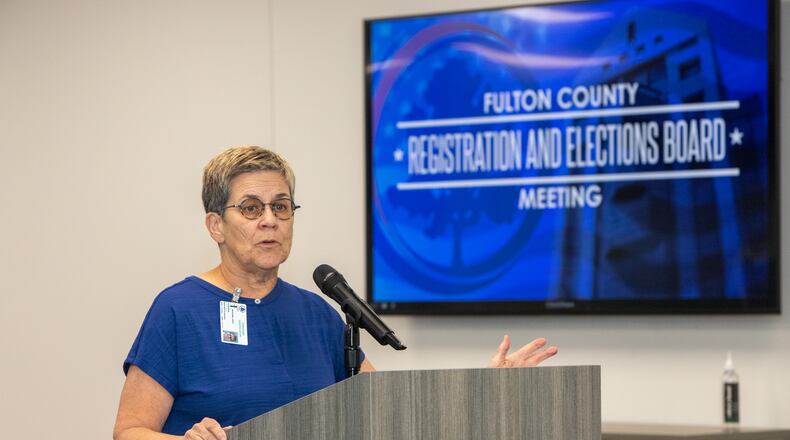 Members of the Fulton County Registration and Elections Board including Chairperson Cathy Woolard addresses the crowd on Tuesday, June 18, 2024.  (Jenni Girtman for The Atlanta Journal-Constitution)