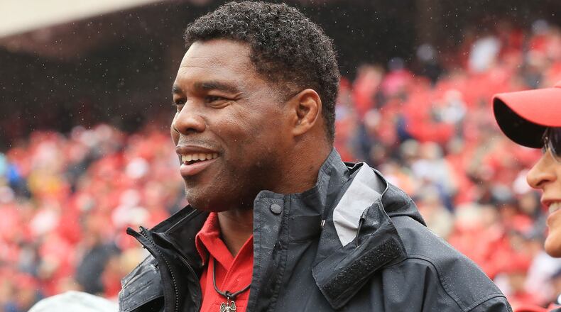 Former Georgia running back Herschel Walker in on the sidelines for the football game against Alabama on Saturday, Oct. 3, 2015, in Athens.