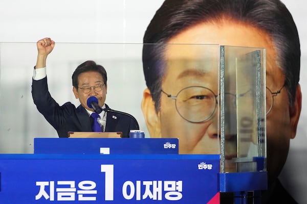 South Korea's Democratic Party's presidential candidate Lee Jae-myung, gestures as he speaks to supporters outside of the National Assembly in Seoul, South Korea, Wednesday, June 4, 2025. (AP Photo/Lee Jin-man)