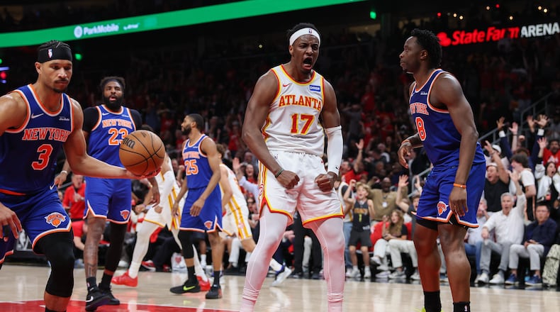 Atlanta Hawks forward Onyeka Okongwu (17) reacts after a dunk against New York Knicks guard Josh Hart (3) and forward Og Anunoby (8) during the first half in Game 3 of a first-round NBA playoffs basketball series, Thursday, April 23, 2026, in Atlanta. (Colin Hubbard/AP)
