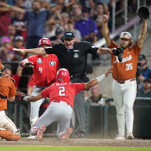 Georgia infielder Ryan Black slides safely into home and scores the second run of the game in the seventh inning during an NCAA baseball College World Series elimination game against Texas, Tuesday, June 16, 2026, in Omaha, Neb. (Vera Nieuwenhuis/AP)