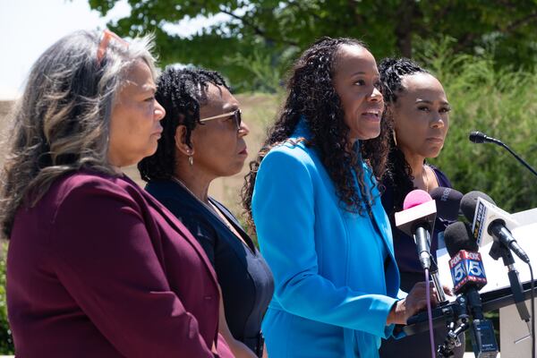DeKalb County District Attorney Sherry Boston, second from right, was improperly threatened by a county judge in 2023, Georgia's judicial watchdog says. (Ben Gray for the AJC)