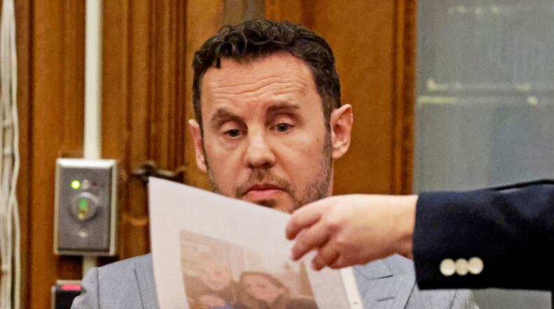 William Fastow, Ana Walshe's boyfriend, looks at a picture of Ana while on the witness stand during Brian Walshe's trial for murdering his wife Ana, Thursday, Dec. 4, 2025, in Dedham, Mass. (Matt Stone/The Boston Herald via AP, Pool)