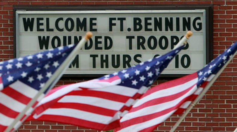 The Locust Grove Municipal Complex welcomed troops Thursday with a sign and flags. The Warrior Transition (wounded troops) Battalion from Ft. Benning came To Noah's Ark Children's Care Home and Animal Rehabilitation Center with two bus loads of soldiers bringing donations for the children.