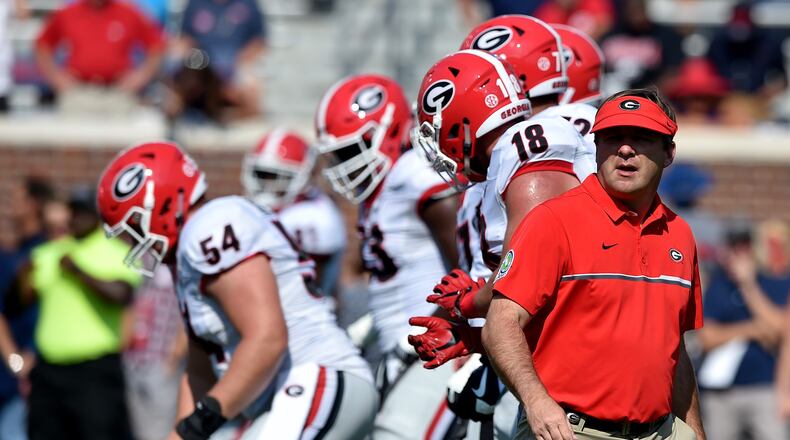 September 24, 2016 Oxford, Miss: Georgia Bulldogs head coach Kirby Smart runs pre-game warm ups with the intensity of a tied ballgame in the 4th quarter. Preparing to take on Ole Miss in Oxford Saturday September 24, 2016. BRANT SANDERLIN/BSANDERLIN@AJC.COM