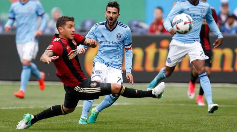 Atlanta United midfielder Carlos Carmona (left) defends New York City FC forward David Villa (7) during the first half
Sunday, May 7, 2017, in New York.