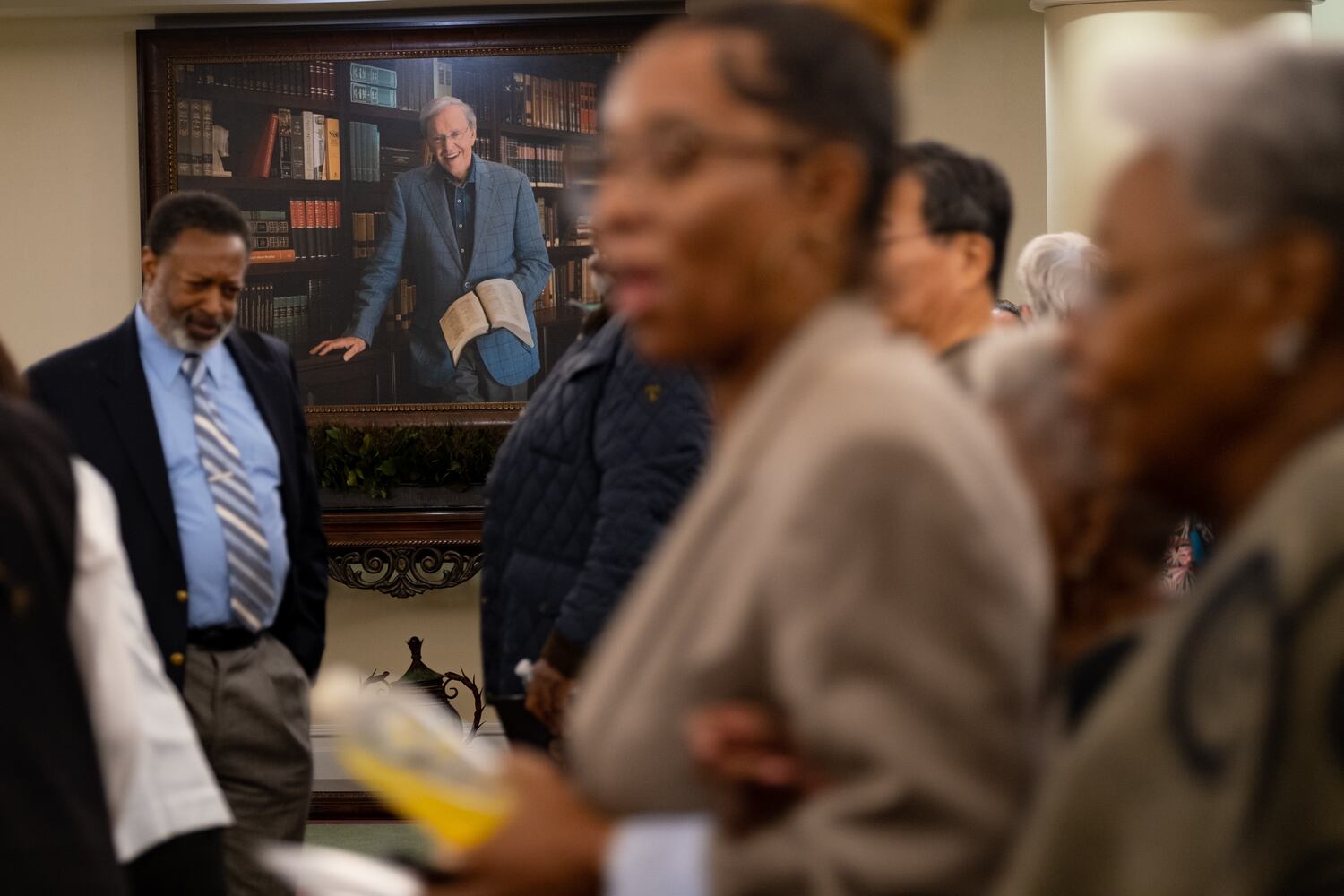 People file past a portrait of the Rev. Charles F. Stanley following his Legacy Celebration Service at First Baptist Atlanta on Sunday, April 23, 2023. (Photo: Ben Gray for The Atlanta Journal-Constitution)

