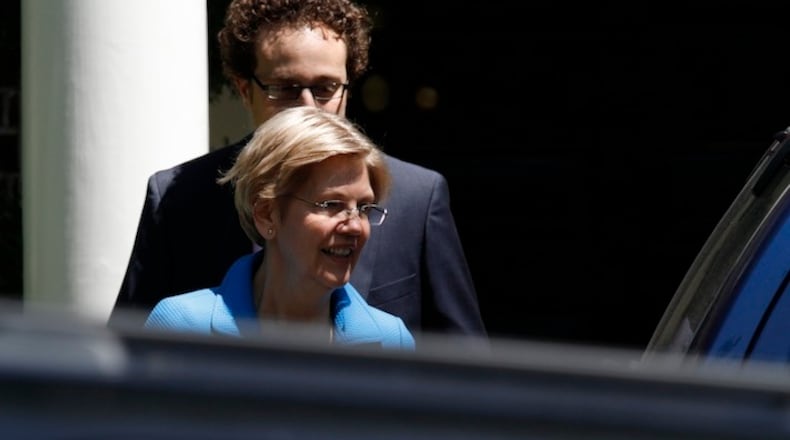 Sen. Elizabeth Warren, D-Mass. leaves the Washington home of Democratic presidential candidate Hillary Clinton. With the primary over and Vermont Sen. Bernie Sanders fading from the spotlight, Warren is stepping up to reclaim her role as leader of the party’s progressives. She’s mobilizing behind Clinton, lending her presidential bid a powerful boost of liberal credibility. (AP Photo/Paul Holston, File)