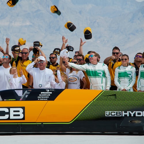 British driver Andy Green, center, and the JCB engineering team celebrate setting a new land speed record for a hydrogen-powered vehicle at the Bonneville Salt Flats in Utah, Tuesday, Aug. 11, 2026. (AP Photo/Hannah Schoenbaum)