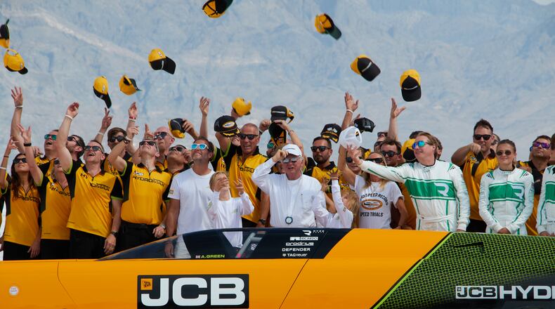 British driver Andy Green, center, and the JCB engineering team celebrate setting a new land speed record for a hydrogen-powered vehicle at the Bonneville Salt Flats in Utah, Tuesday, Aug. 11, 2026. (AP Photo/Hannah Schoenbaum)
