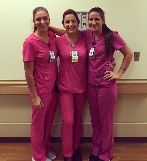 Twins Mckenna Roberts (far left) and Mary Kate Harris (far right) pose with their mother and fellow nurse Sarah Rushton at Northeast Georgia Medical Center in Gainesville. The three share a passion for helping others, especially babies. (Courtesy of Georgia Medical Center)