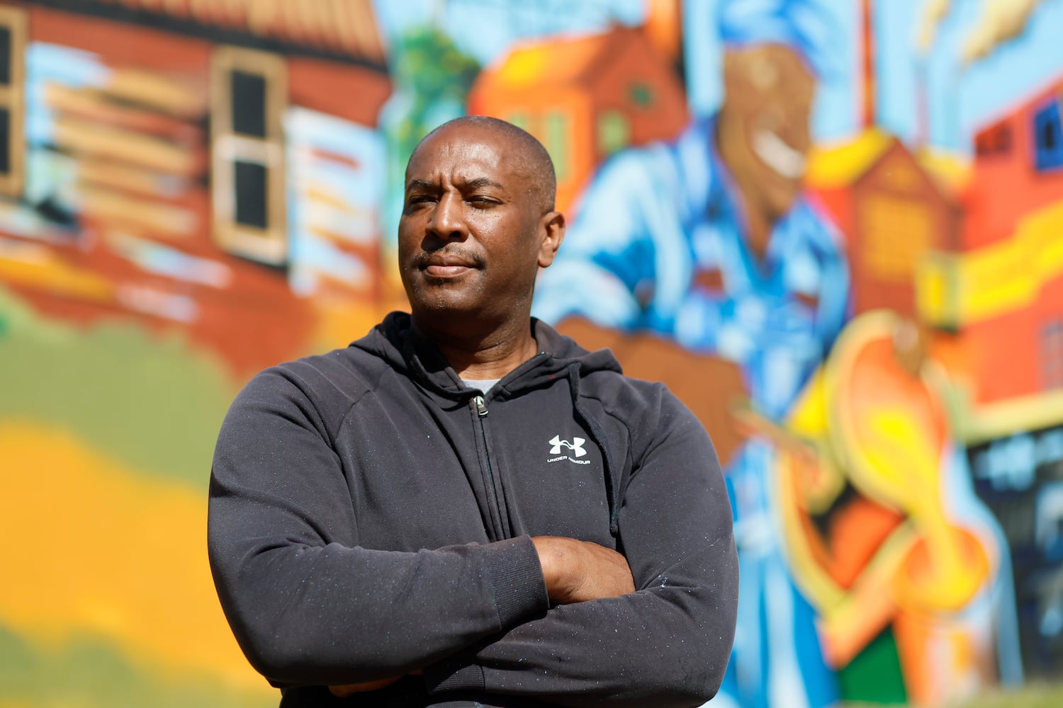 Muralist Corey Barksdale designs art on WM Black community