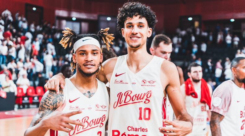 Former Tucker High and Auburn star Bryce Brown (with headband) poses with the Hawks' first overall draft pick Zaccharie Risacher during their time as teammates at JL Bourg in the French professional league in the 2023-24 season. (Photo by Vincent Chabrier/JL Bourg)