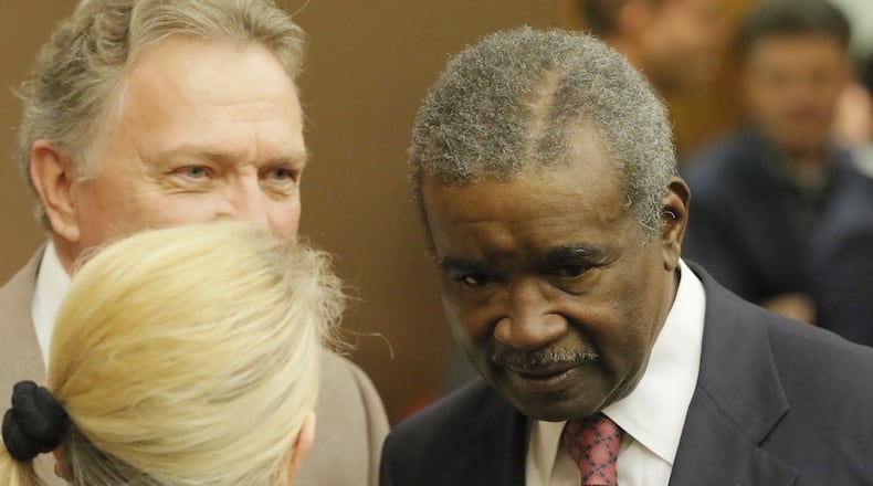 Fulton County Tax Commissioner Arthur E. Ferdinand speaks with people after DeKalb County Judge Alan Harvey approved the county’s request to collect property taxes. BOB ANDRES/BANDRES@AJC.COM
