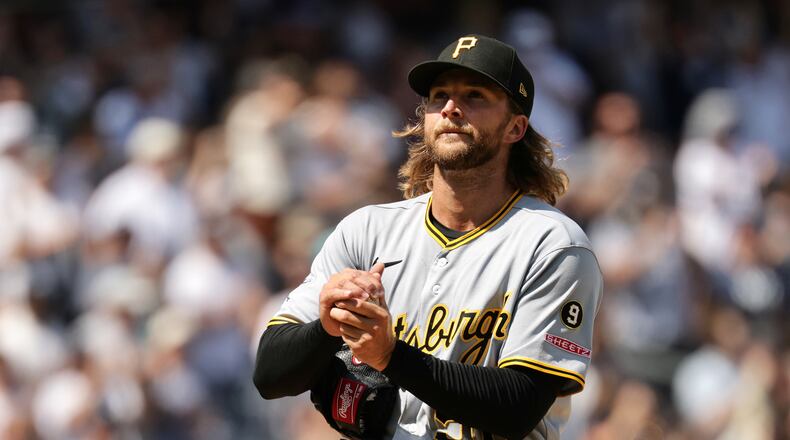 Pittsburgh Pirates pitcher Carmen Mlodzinski reacts after giving up a three-run home run to New York Yankees' Ben Rice in the seventh inning during the first baseball game of a doubleheader, Wednesday, July 22, 2026, in New York. (AP Photo/Adam Hunger)