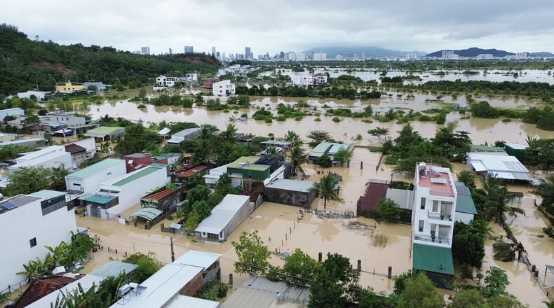 Houses are submerged by floods in Khanh Hoa, Vietnam, Nov. 20, 2025. (Nguyen Huy Thanh/VNA via AP)