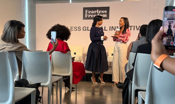 Arian Simone (left), CEO and co-founder of venture capital firm Fearless Fund, speaks with CNN anchor Abby Phillip at the firm's inaugural Fearless Global Initiative in New York on Monday, Sep. 22, 2025. (Mirtha Donastorg/AJC)