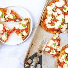 Naan provides a simple stand-in for the crust in homemade versions of the Bolognese pizza from Lloyd's Restaurant and Lounge in Inman Park. (Credit: Aaliyah Mann for the AJC, styling by Kate Itrich-Williams)