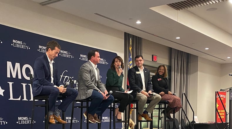 Moms for Liberty co-founder Tina Descovich (center) leads a panel discussion with Georgia Republican lawmakers Sen. Greg Dolezal (from left), Sen. Clint Dixon, Rep. Scott Hilton and Rep. Mesha Mainor on Nov. 13, 2023, at the Gas South Convention Center in Duluth. (Josh Reyes / Josh.Reyes@ajc.com)