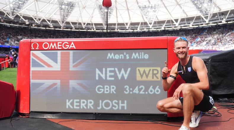 Britain's Josh Kerr celebrates after winning and breaking a world record in the Men's 1 Mile final during the Novuna London Athletics Meet at the London Stadium, Saturday July 18, 2026. (Adam Davy/PA via AP)