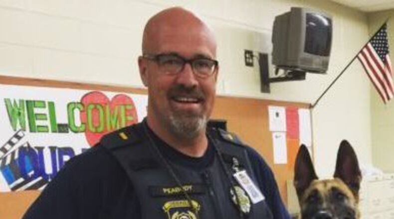 K-9 Inca with Cherokee County school police officer Lt. Daniel Peabody. (Credit: Twitter/MJohnsonWSB)