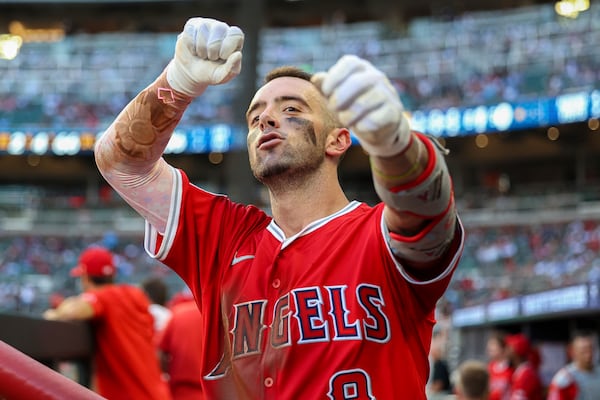 Los Angeles Angels' Zach Neto celebrates in the dugout after hitting a solo home run in the fourth inning of a baseball game against the Atlanta Braves, Thursday, July 3, 2025, in Atlanta. (AP Photo/Colin Hubbard)
