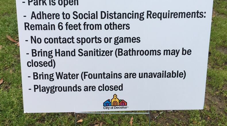 These signs were posted at each City of Decatur Park Tuesday March 24, the same day the city issued an Emergency Stay At Home order. Bill Banks for the AJC