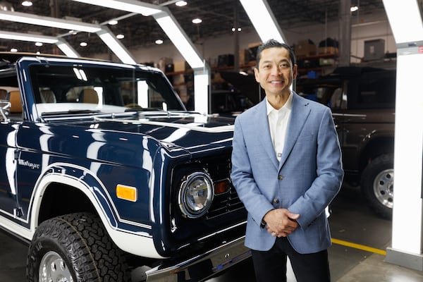 Vintage Modern founder and CEO Chau Nguyen poses for a portrait in his company's headquarters and auto shop on June 26, 2026. (Estela Muñoz/AJC)