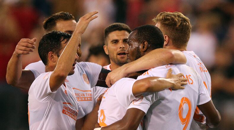 Atlanta United forward Romario Williams (right) celebrates his goal for a 3-0 victory over Charleston Battery with teammates during the second half in a U.S. Open Cup match on Wednesday, June 6, 2018, in Kennesaw. Curtis Compton/ccompton@ajc.com